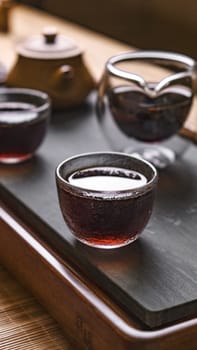 A serene tea setup with exquisite glass teacups and an elegant teapot, perfect for relaxation moments