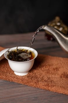 A beautifully serene scene of green tea being poured into a delicate cup, showcasing tea culture and tranquil moments