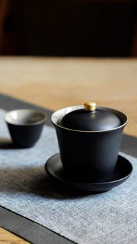 This stylish black tea set includes an elegant teapot and a sophisticated cup, ideal for modern tea lovers