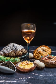 Indulge in a rich and delightful assortment of exquisite desserts, artfully paired with elegant wine selections