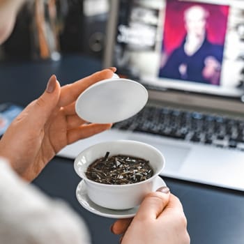 A serene moment dedicated to meticulously preparing tea, blending rich tradition with modern technology