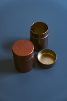 These elegant metal storage containers, featuring warm tones, are perfect for both organizing and enhancing home decor