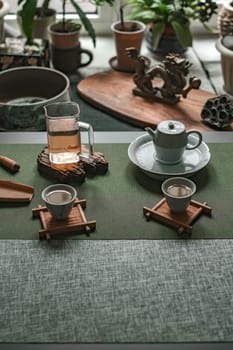 A serene tea placement showcasing exquisite teaware amid lush greenery, ideal for ultimate relaxation benefits