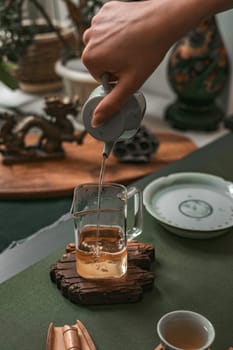 A peaceful and serene tea brewing process that showcases elegant teaware and fosters a tranquil atmosphere