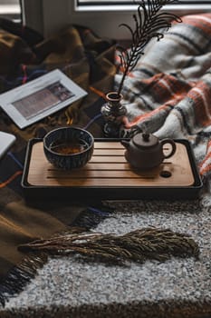 A tranquil tea arrangement beautifully featuring a charming teapot, elegant cup, and lovely decorative elements