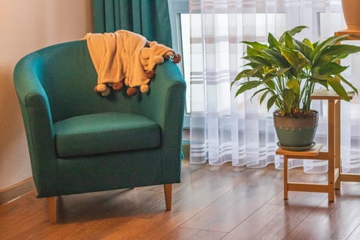 Close up of the cozy corner in the apartment with comfortable arm chair