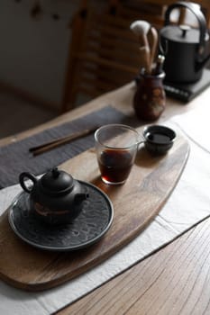 A beautifully arranged tea set on a wooden tray, showcasing tranquility and elegance in tea culture.