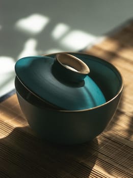 Discover a stylish lidded bowl with modern design and serene colors, perfect for decor or serving needs