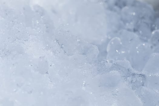 Textured cold frosty surface of ice. Ice texture crystal, blue tones background. Natural winter backdrop. High quality photo