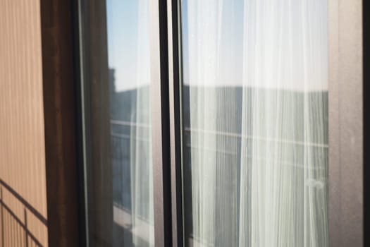 An elegantly designed sleek balcony view that showcases beautiful sheer curtains
