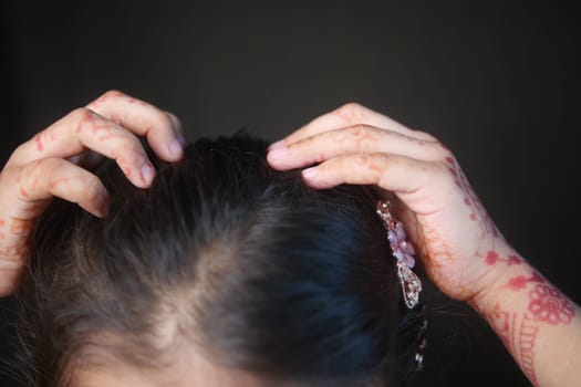 child Scratching her Head closeup