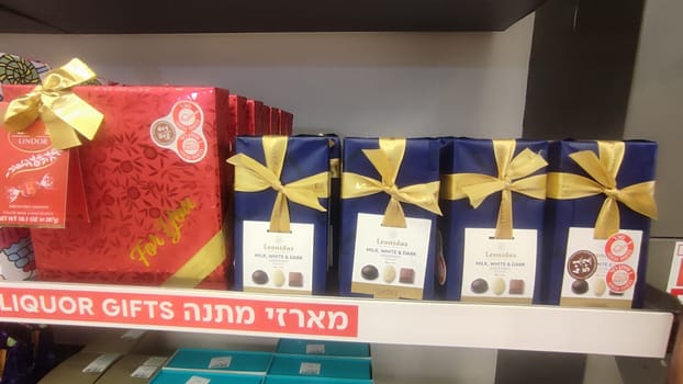 15 October 2024 Tel-Aviv Israel Ben Gurion airport, Terminal 3, aircraft departures board, tourist lounge duty free shop chocolate sweets gifts High quality editorial photo