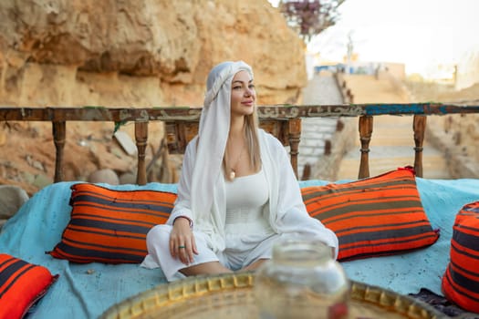 Portrait of a beautiful woman in Arabic clothing in Egypt during sunset