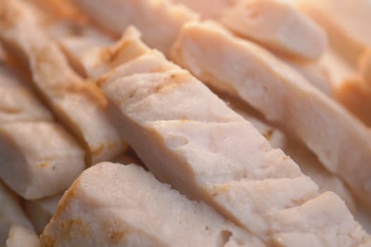 Freshly sliced cooked chicken breast showcasing its incredibly tender texture and flavor