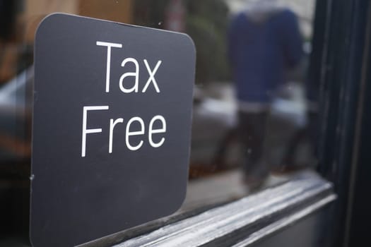 shop tax free text duty free shop sign on shop window ,