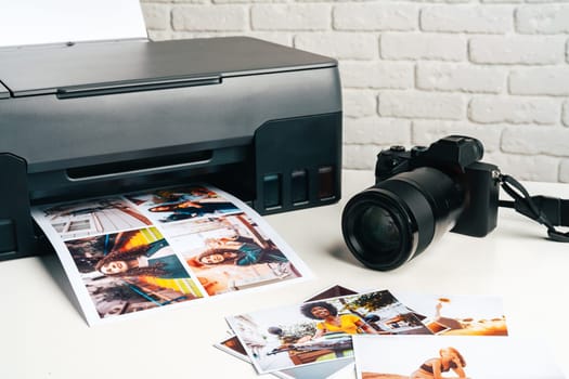 Printer and photo camera on the table. Printing photos concept