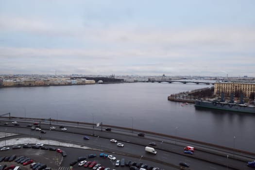 On a cloudy day, experience a breathtaking view of a scenic river beautifully surrounded by urban scenery