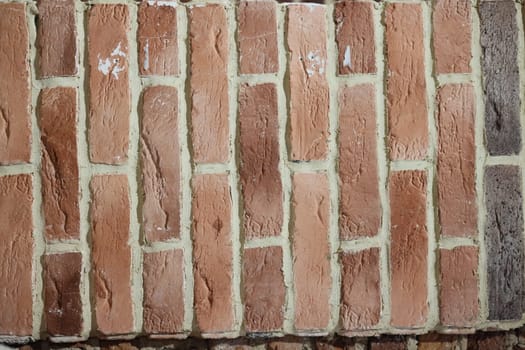 This is a detailed view of a classic brick wall that showcases the unique texture and color variations present