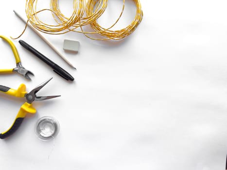 Crafting tools and materials on white background.