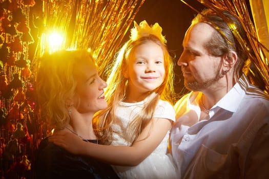 Family enjoys a joyful moment together, surrounded by festive decorations, celebrating the holiday spirit.