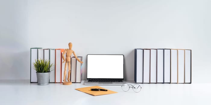 Laptop computer mockup blank white screen on table in white background. laptop with blank screen on table of workplace contemporary white background.