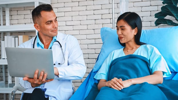 Doctor in professional uniform examining patient at hospital or medical clinic. Health care , medical and doctor staff service concept. Jivy