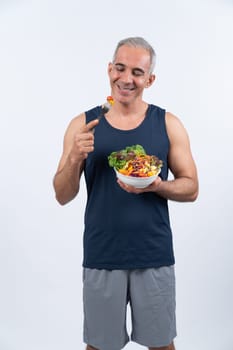 Happy smile senior man portrait holding bowl of vegan fruit and vegetable on isolated background. Healthy senior people with healthy vegetarian nutrition and body care lifestyle. Clout