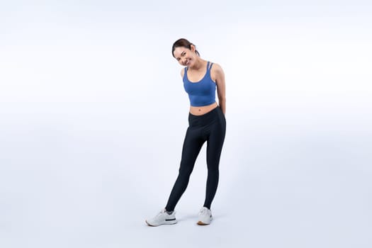 Full body asian woman in sportswear portrait, smiling and posing cheerful gesture. Workout training with attractive girl engage in her pursuit of healthy lifestyle. Isolated background Vigorous