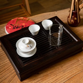 An elegant tea set beautifully arranged on a wooden tray, ideal for cherished tea ceremonies and social gatherings