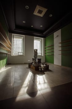 This is a stylish, minimalist room that features beautiful green walls and striking light patterns throughout