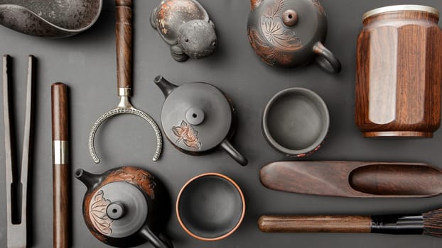 This is an artfully arranged curated collection featuring rustic teapots and various tools displayed aesthetically