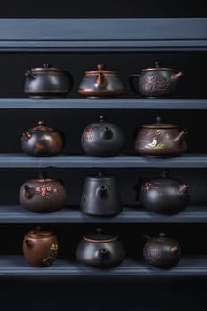 This is a stunning arrangement of uniquely designed teapots that showcase exquisite craftsmanship and artistic design