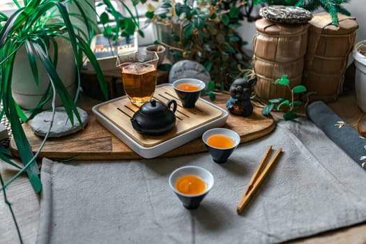A serene arrangement features a charming teapot, elegant cups, and natural elements, ideal for tea lovers