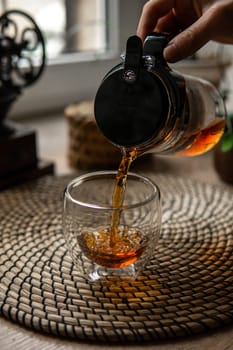 A cozy scene with tea in a delicate cup brings comfort and deep relaxation, enhancing the experience