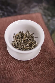 Artfully arranged loose leaf tea in a stunning display, showcasing its delightful natural hues and intricate textures