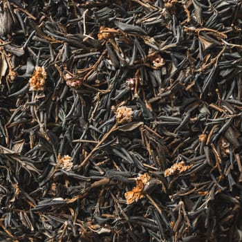 A closeup view of dried black tea leaves, which are ideal for use in brewing or various culinary applications