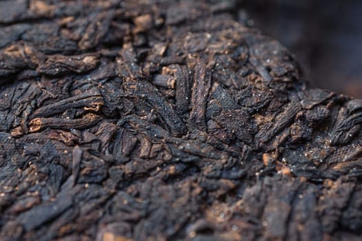 A detailed, closeup image of the intricate texture of charred wood, emphasizing its unique and beautiful patterns