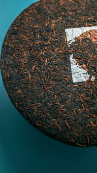 A closeup of a scrumptious tea cake highlighting its textures and vibrant colors against a teal backdrop