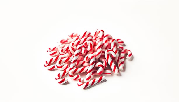 A small pile of neatly rearranged red and white striped candy canes viewed from a slightly elevated angle on a plain white background. This organized heap highlights the candy canes' colorful and festive appearance while maintaining a playful and casual feel.