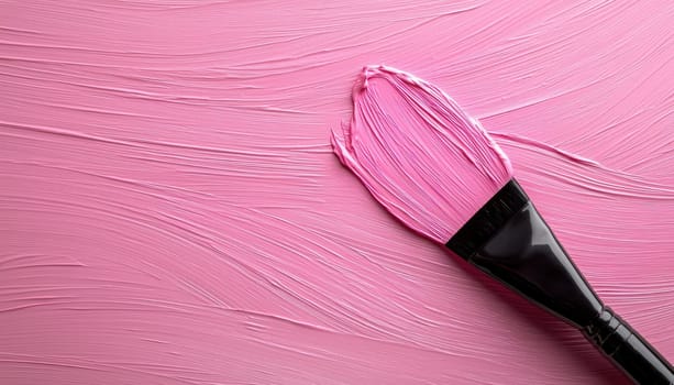 A hairdresser applying pink hair dye with brush on smooth surface, showcasing artistic precision and creativity