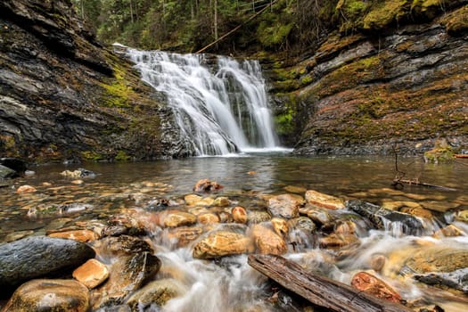 Water flows over rocks at lower Sweetcreek Falls, near Metaline, Washington.