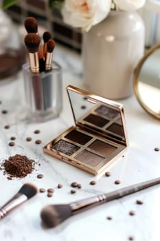 Mocha mousse-themed eyeshadow palette featuring rich, neutral shades, sits on a makeup counter. accompanied by makeup brushes, a small mirror, and scattered earth-toned powders, an elegant, everyday beauty routine.