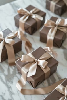 Mocha mousse gift boxes adorned with beige satin ribbons are artfully arranged on a marble surface, exuding elegance and sophistication. perfect for special occasions, these gift boxes symbolize luxury and thoughtful gifting.