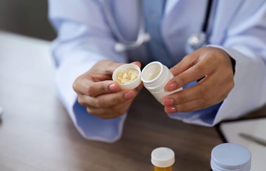 A doctor in a medical office prescribes medication to a patient, emphasizing healthcare and wellness.