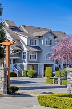 Gated residential complex on spring sunny day in British Columbia.