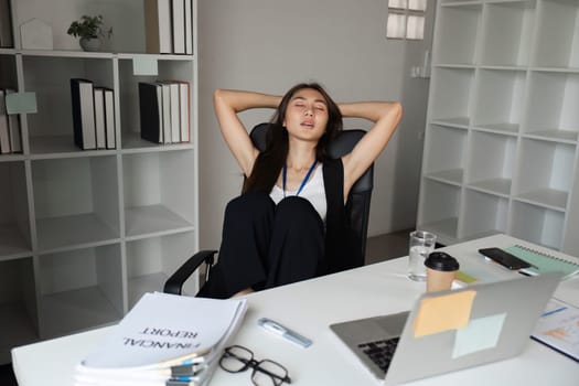 A tired office worker rests at their desk, surrounded by paperwork and a coffee cup, capturing the essence of workplace fatigue.