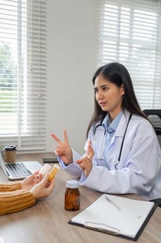 A doctor consults online, recommending medication for effective treatment, showcasing modern healthcare practices.