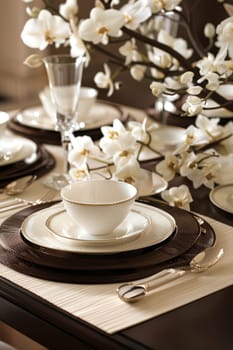 A sophisticated dining table setup showcasing mocha mousse, cream plates, and an elegant floral arrangement. the scene features fine glassware and cutlery, creating a luxurious atmosphere ideal for dinner parties and special gatherings.