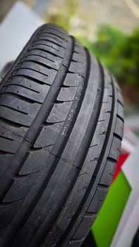detailed image of a brand new car tire showcasing its intricate tread pattern for enhanced grip and performance, for vehicle