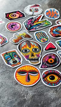 A collection of uniquely designed, intricately detailed stickers featuring various quirky animal and creature motifs placed on a textured gray surface. the dramatic lighting emphasizes the boldness of each design, ideal for creative projects.